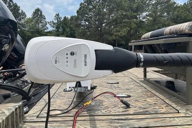 Slide: The Image of 2026 Tracker Grizzly 2072 CC Sportsman Kicker boat with Riptide trolling motor on deck. - 23