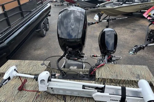 Slide: The Image of 2026 Tracker Grizzly 2072 CC Sportsman Kicker boat with dual motors and Minn Kota trolling motor. - 6