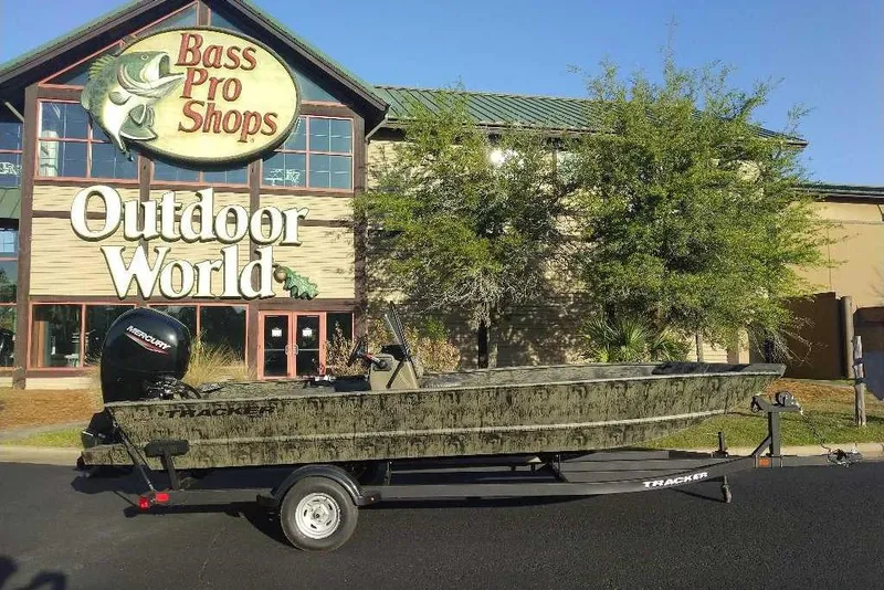 The Image of 2026 Tracker Grizzly 2072 CC boat on trailer outside Bass Pro Shops Outdoor World. - 0