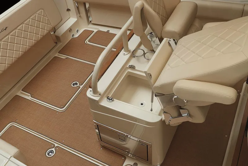 Slide: The Image of Manufacturer Provided Image: 2024 Chris-Craft Catalina 30 interior with beige seating and storage compartments. - 14