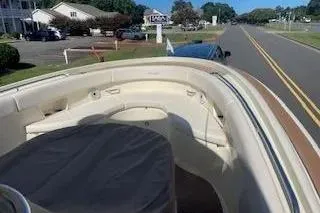 Slide: The Image of 2024 Chris-Craft Catalina 30 boat interior with seating, parked near a road. - 23