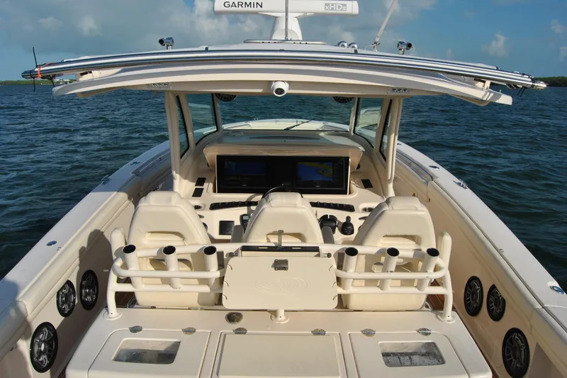 Slide: The Image of 2018 Grady-White Canyon 376 boat interior with advanced navigation system on open water. - 13