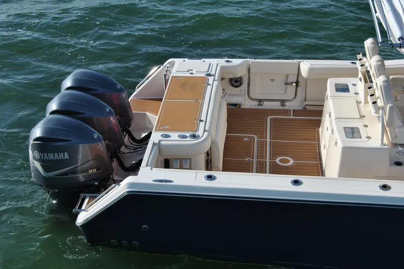 Slide: The Image of 2018 Grady-White Canyon 376 boat with Yamaha V8 engines on water. - 6