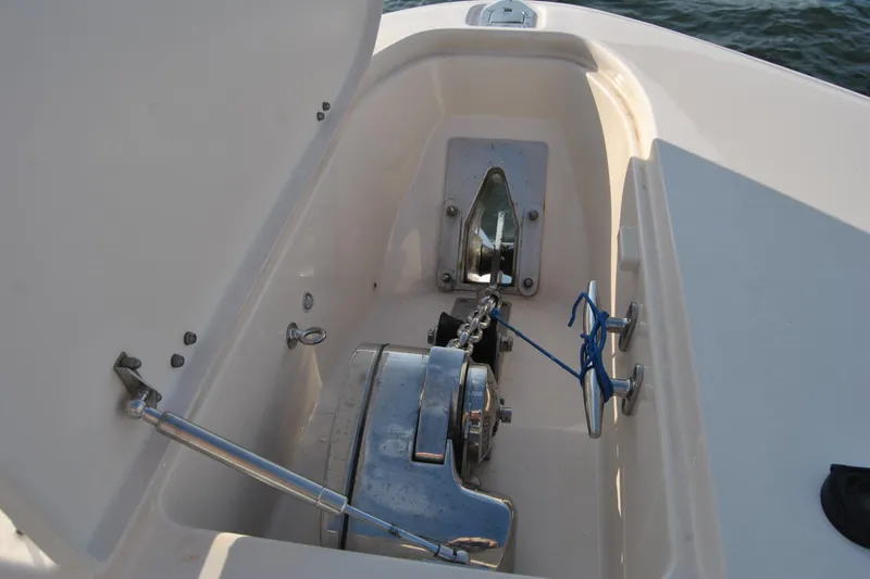 Slide: The Image of Anchor compartment of 2018 Grady-White Canyon 376 boat with winch and chain. - 8