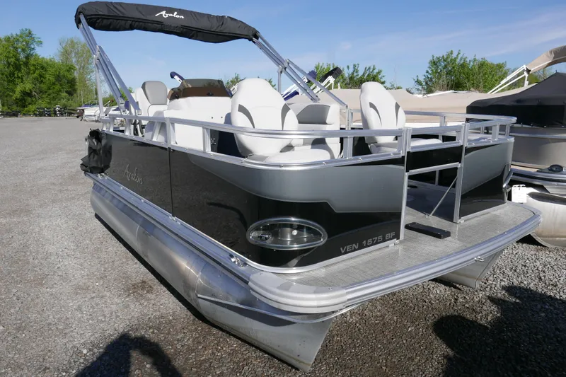 The Image of 2024 Avalon Venture Bow Fish 1575 pontoon boat, sleek design, parked outdoors. - 0