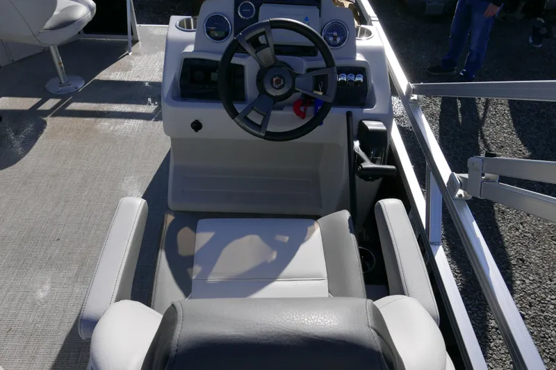 Slide: The Image of 2024 Avalon Venture Bow Fish 1575 boat interior with steering wheel and seating. - 8