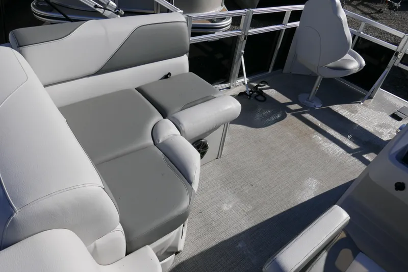 Slide: The Image of 2024 Avalon Venture Bow Fish 1575 interior with gray seating and spacious deck area. - 9