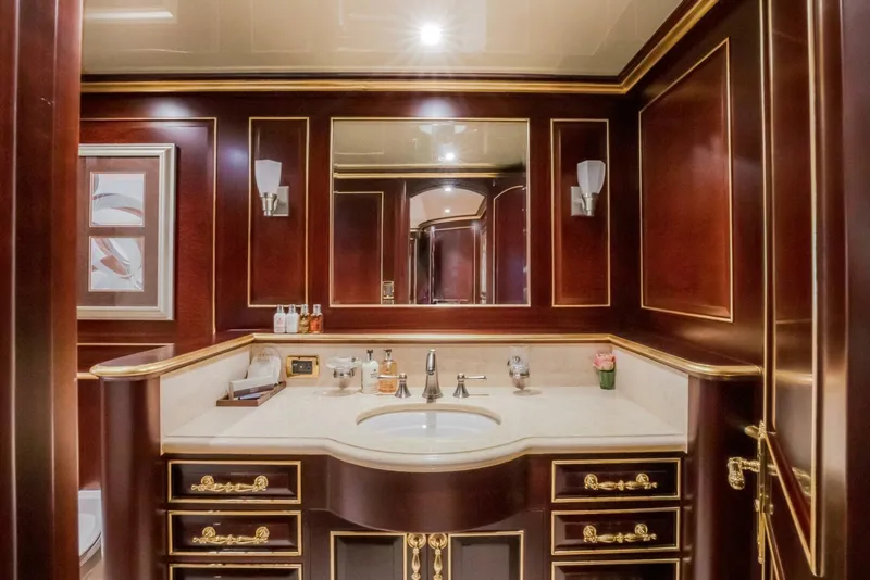 Slide: The Image of Luxurious yacht bathroom with elegant wood paneling and gold accents, Horizon Model Tri-Deck 2009. - 33