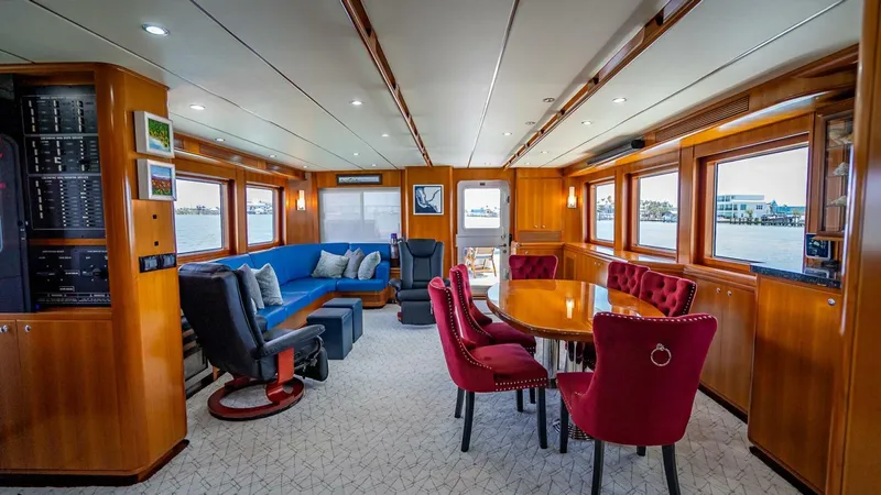 Slide: The Image of Luxurious interior of 2009 Nordhavn 76 yacht with elegant seating and dining area. - 10