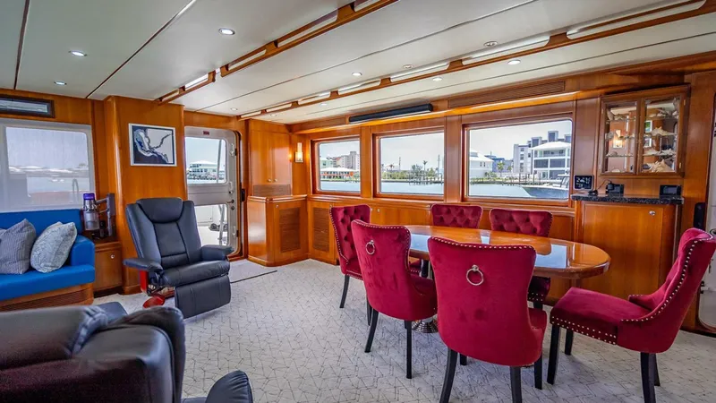 Slide: The Image of Luxurious interior of 2009 Nordhavn 76 yacht with elegant dining area and plush seating. - 12
