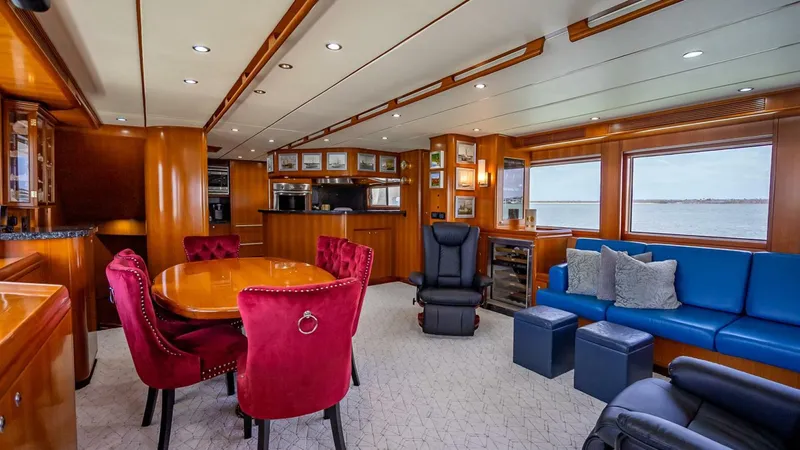 Slide: The Image of Luxurious interior of 2009 Nordhavn 76 yacht with elegant seating and dining area. - 13