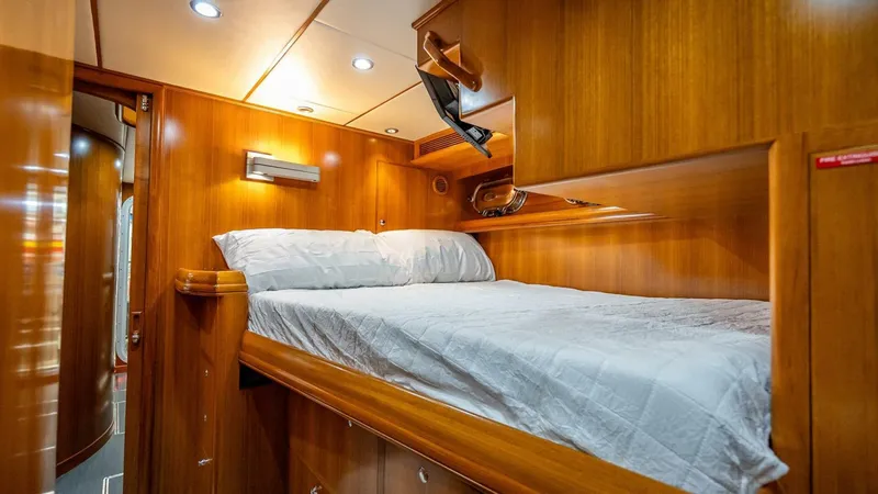 Slide: The Image of Luxurious wooden cabin interior of 2009 Nordhavn 76 yacht with cozy bed. - 26