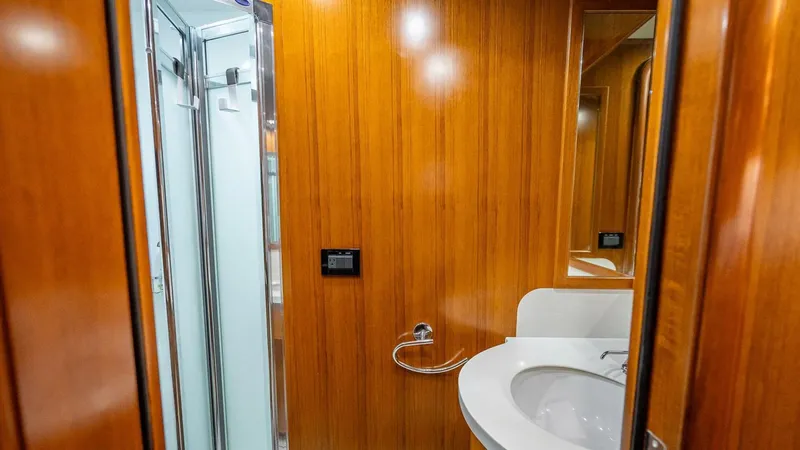 Slide: The Image of Luxurious bathroom in 2009 Nordhavn 76 yacht with wooden paneling and modern fixtures. - 27