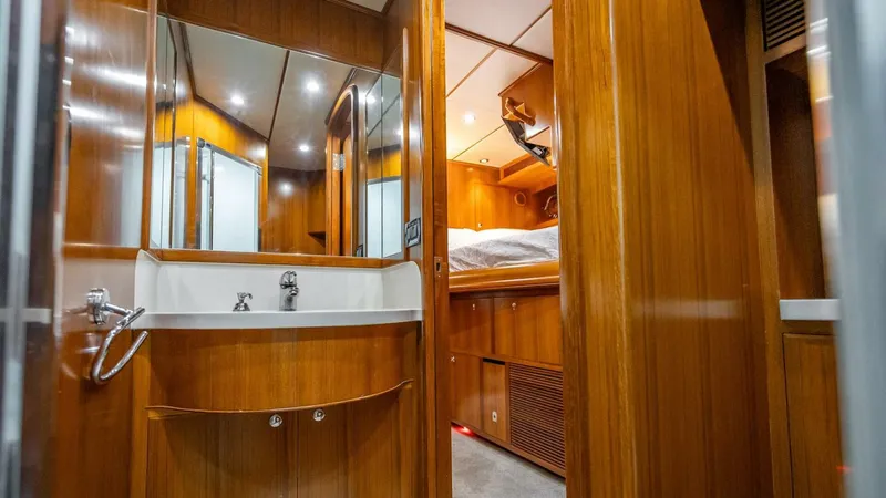 Slide: The Image of Luxurious wooden interior of 2009 Nordhavn 76 yacht cabin with sink and bed. - 28