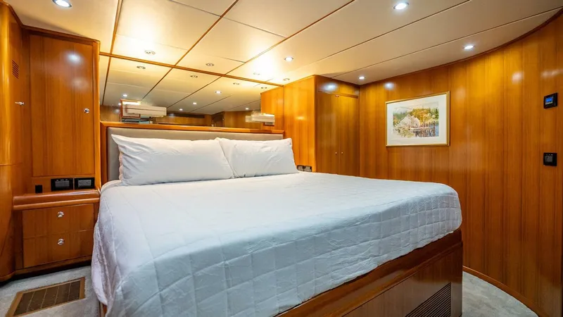 Slide: The Image of Luxurious cabin interior of 2009 Nordhavn 76 yacht with wood paneling and cozy bed. - 30