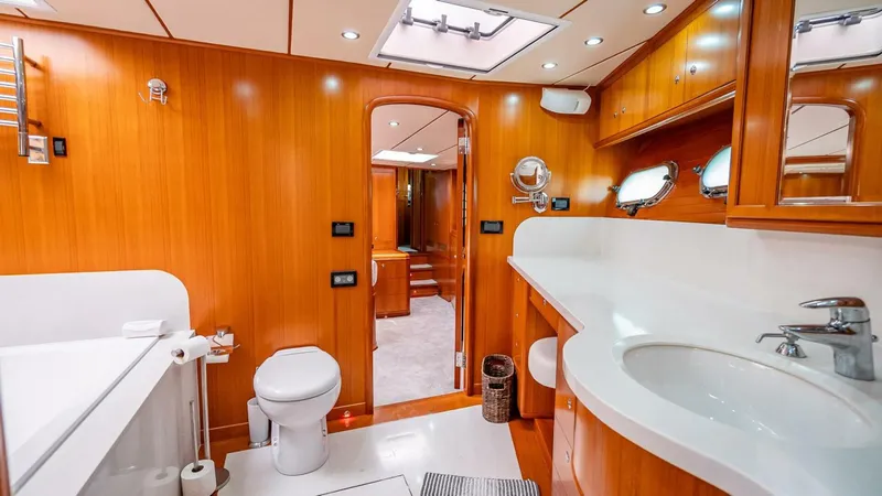 Slide: The Image of Luxurious bathroom in 2009 Nordhavn 76 yacht with wooden cabinetry and modern fixtures. - 37