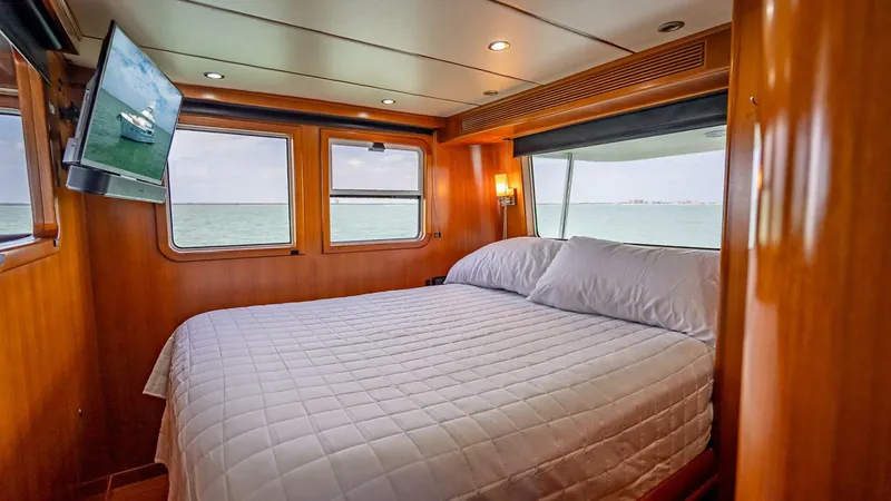 Slide: The Image of Luxurious cabin interior of 2009 Nordhavn 76 yacht with ocean view and cozy bed. - 38