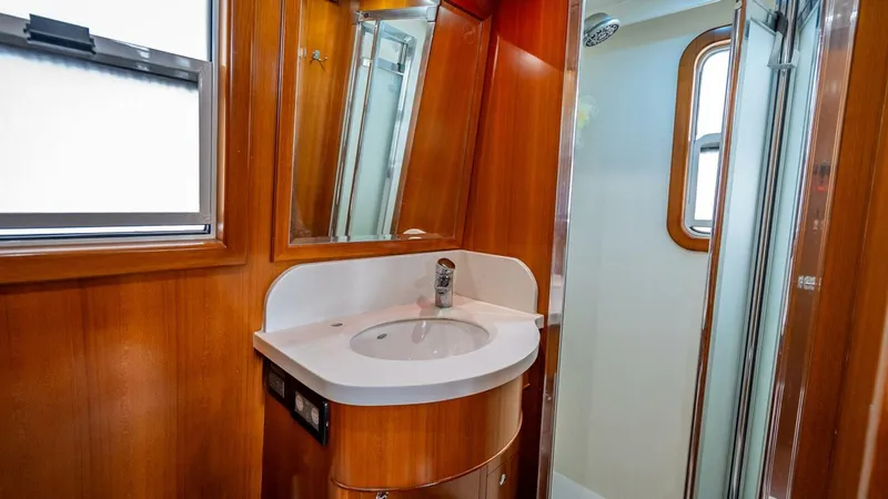 Slide: The Image of Bathroom interior of 2009 Nordhavn 76 yacht with wooden cabinetry and modern fixtures. - 39