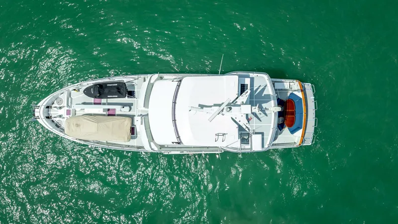 Slide: The Image of Aerial view of 2009 Nordhavn 76 yacht on turquoise water. - 4