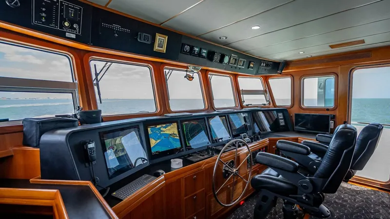 Slide: The Image of Pilothouse of 2009 Nordhavn 76 yacht with navigation screens and ocean view. - 41