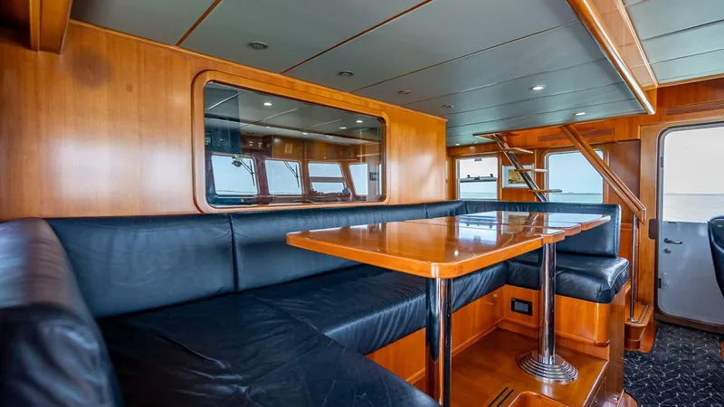Slide: The Image of Luxurious interior of 2009 Nordhavn 76 yacht with wood paneling and leather seating. - 44