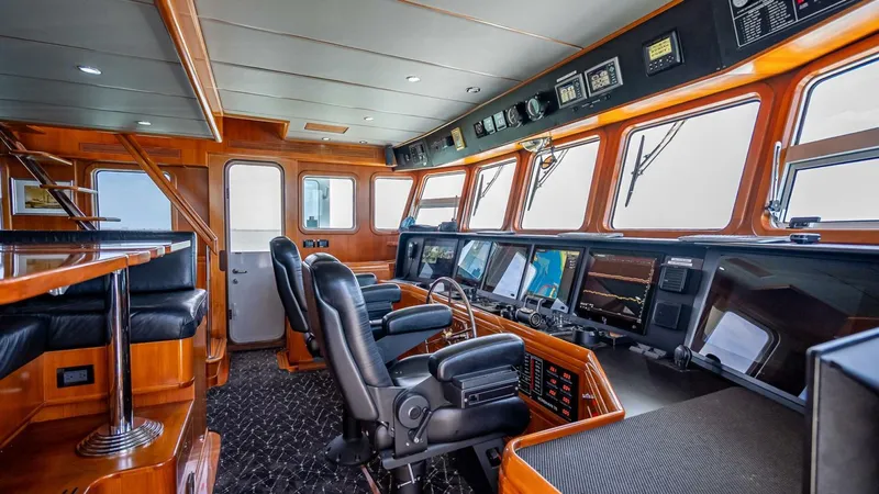 Slide: The Image of Pilothouse of 2009 Nordhavn 76 yacht with advanced navigation equipment and luxurious seating. - 45
