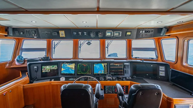 Slide: The Image of Pilothouse of 2009 Nordhavn 76 yacht with navigation equipment and ocean view. - 47