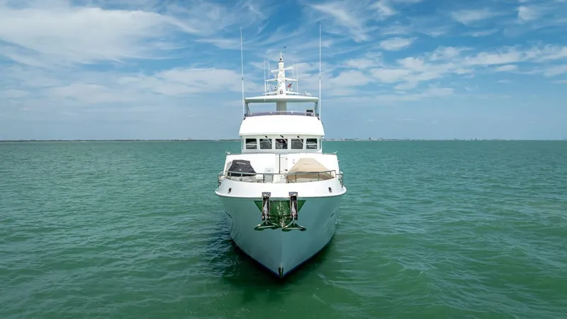 Slide: The Image of Nordhavn 76 yacht from 2009 on open sea under blue sky. - 6