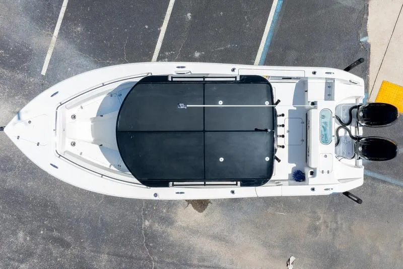 Slide: The Image of Overhead view of 2025 Sea Pro 262 Offshore boat in parking lot. - 16