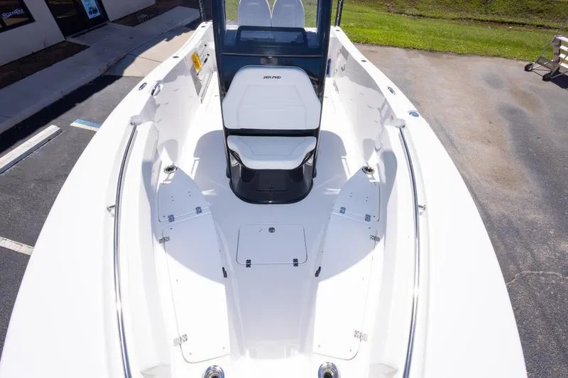 Slide: The Image of 2025 Sea Pro 262 Offshore boat, white deck, spacious seating, outdoor setting. - 19