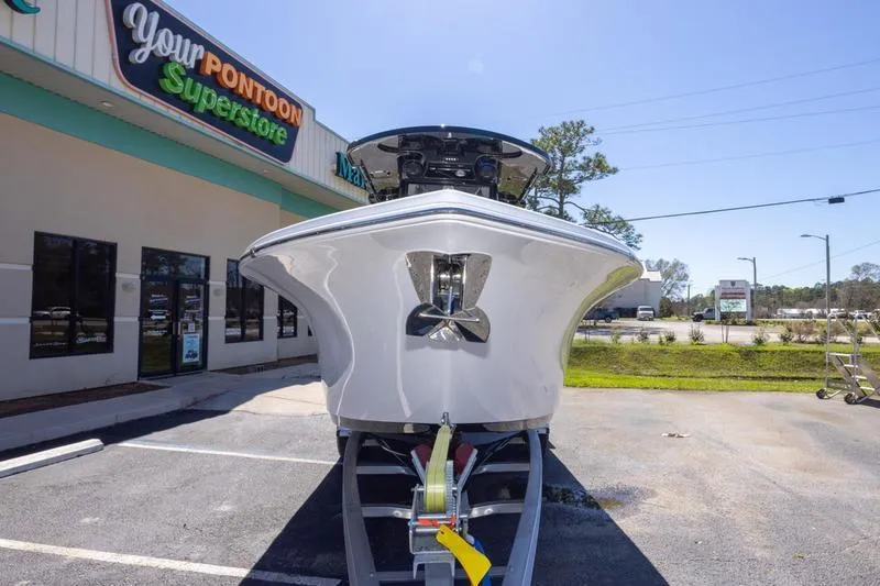 Slide: The Image of 2025 Sea Pro 262 Offshore boat on trailer at dealership parking lot. - 24