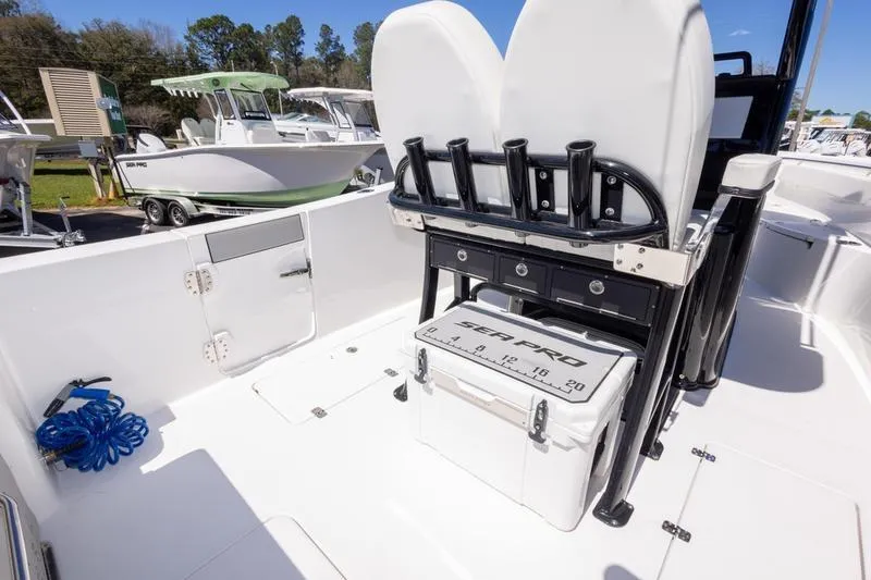 Slide: The Image of 2025 Sea Pro 262 Offshore boat interior with seating and storage features. - 33