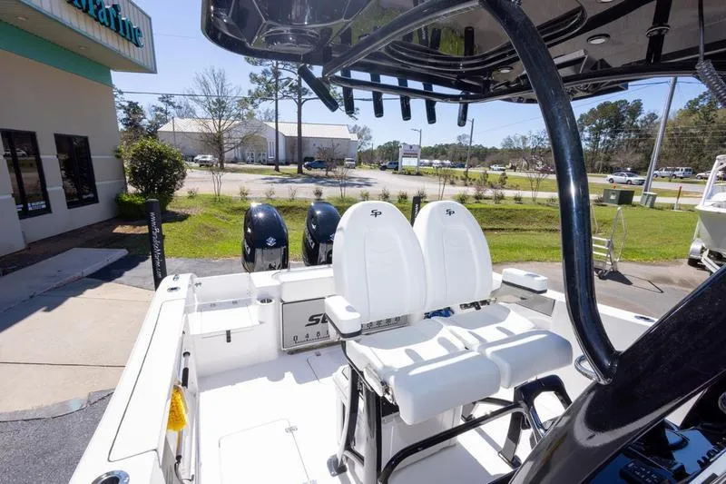 Slide: The Image of 2025 Sea Pro 262 Offshore boat interior with dual seats and twin engines. - 35