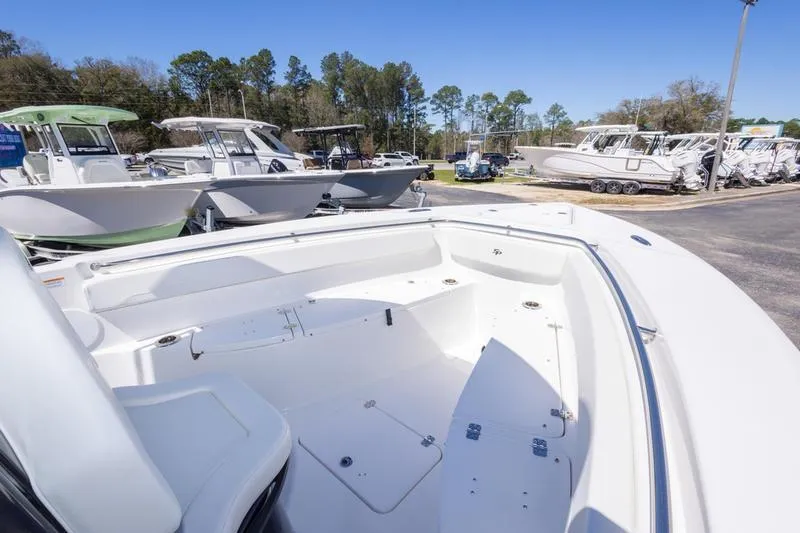 Slide: The Image of 2025 Sea Pro 262 Offshore boat displayed in a marina with other vessels. - 36