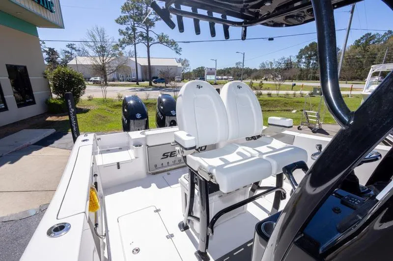 Slide: The Image of 2025 Sea Pro 262 Offshore boat interior with dual seats and twin engines. - 38