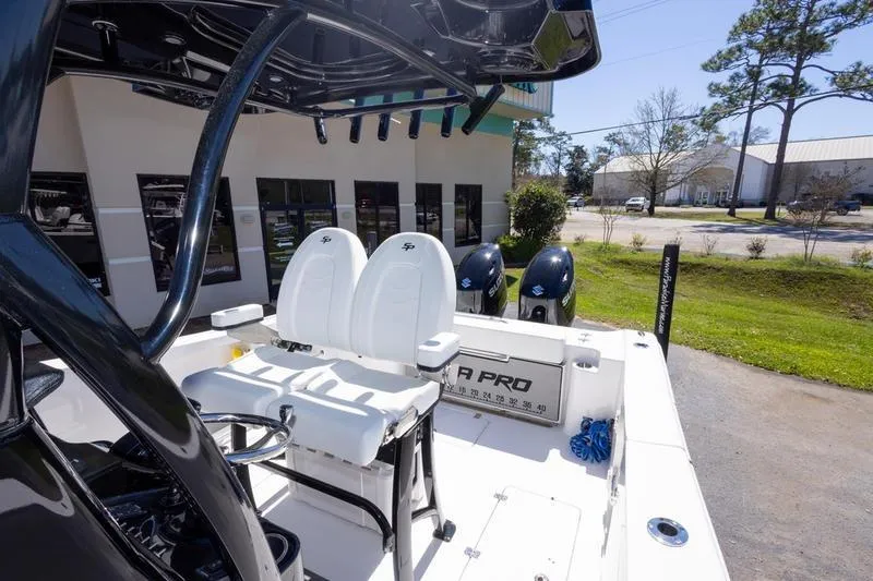Slide: The Image of 2025 Sea Pro 262 Offshore boat interior with dual seats and outboard motors. - 39