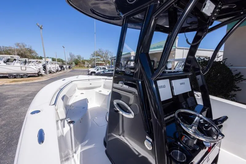 Slide: The Image of 2025 Sea Pro 262 Offshore boat with sleek black console and spacious deck. - 40