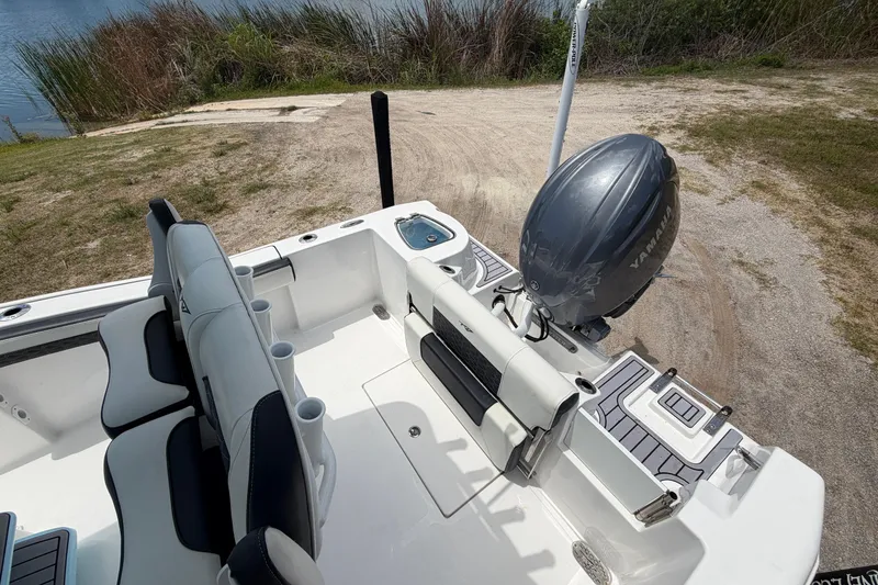 Slide: The Image of 2024 Tidewater 210 CC Adventure boat interior with Yamaha outboard motor. - 16