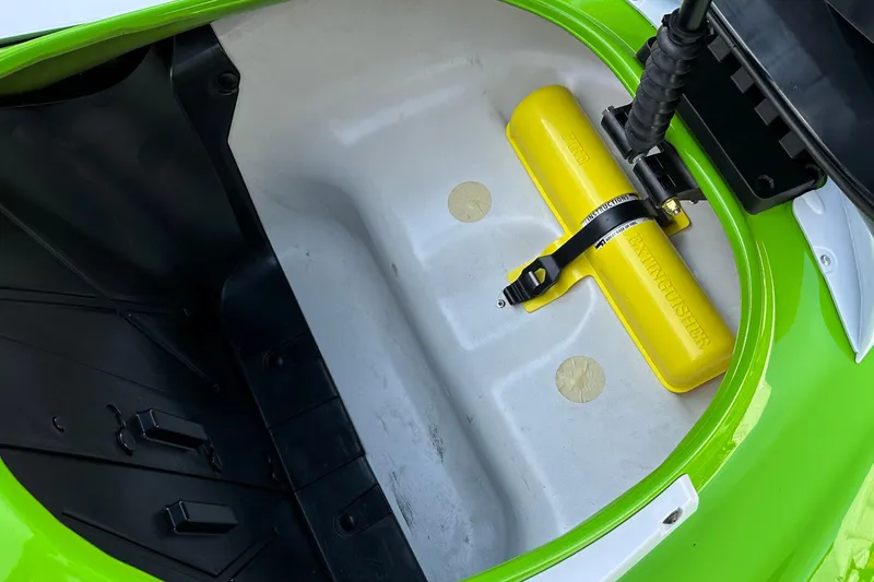 Slide: The Image of Yamaha WaveRunner FX Cruiser HO 2021 storage compartment with yellow safety accessory. - 12