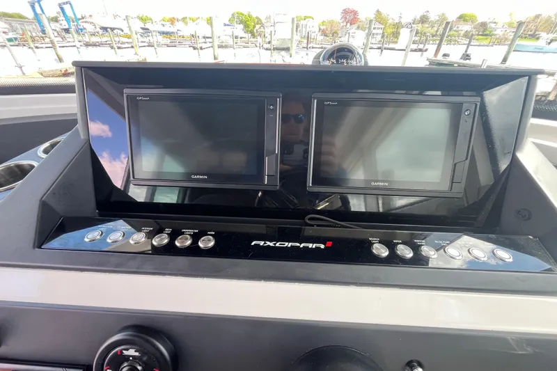 Slide: The Image of Dashboard of a 2019 Axopar 28 Cabin boat with Garmin GPS displays. - 6