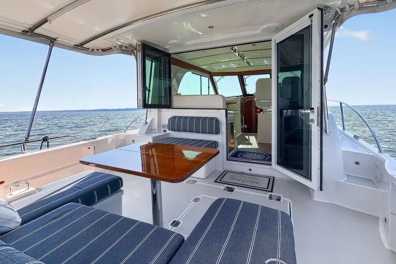 Slide: The Image of 2024 Back Cove 39O yacht with elegant seating and open enclosure - 11