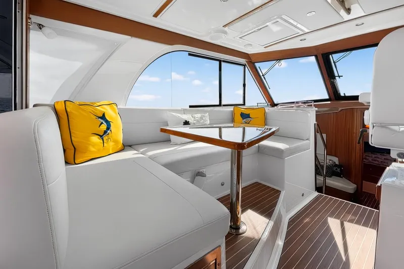 Slide: The Image of Luxurious interior of 2024 Back Cove 39O yacht with elegant seating and nautical decor. - 15