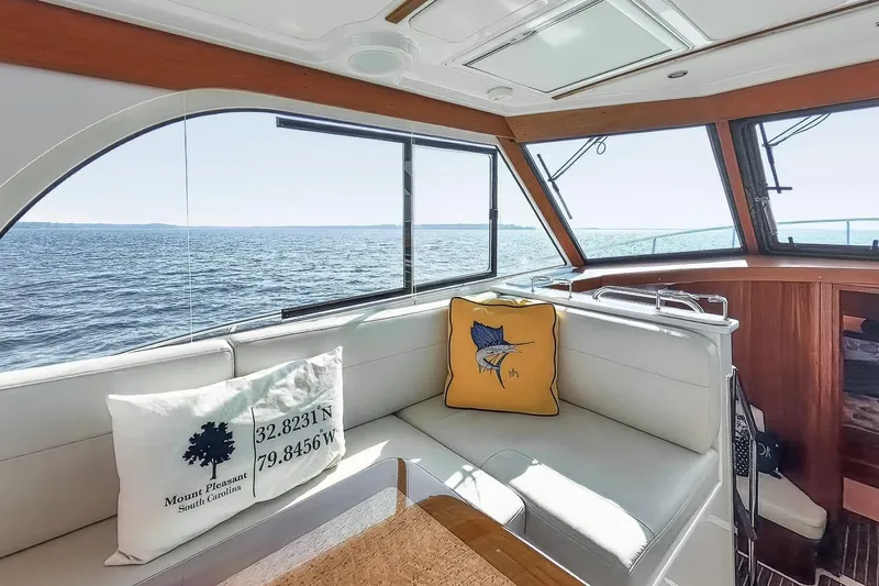 Slide: The Image of Interior of 2024 Back Cove 39O yacht with ocean view and decorative pillows. - 16