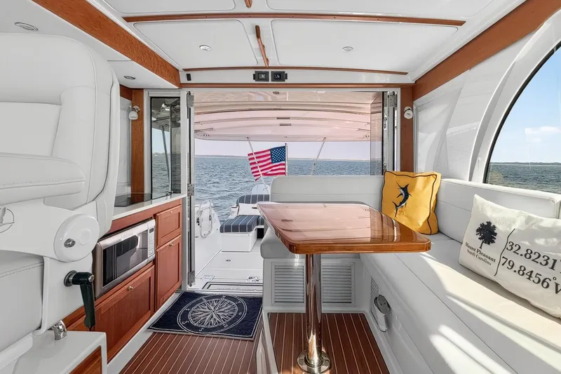 Slide: The Image of Luxurious interior of 2024 Back Cove 39O yacht with open enclosure, 360 degree view and elegant seating. - 18