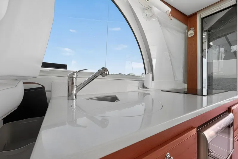 Slide: The Image of 2024 Back Cove 39O yacht interior with sleek kitchen countertop and modern faucet. - 22