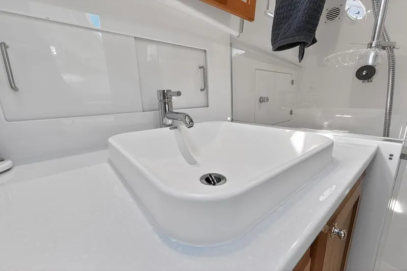 Slide: The Image of Modern bathroom sink in 2024 Back Cove 39O yacht, featuring sleek design and chrome faucet. - 47