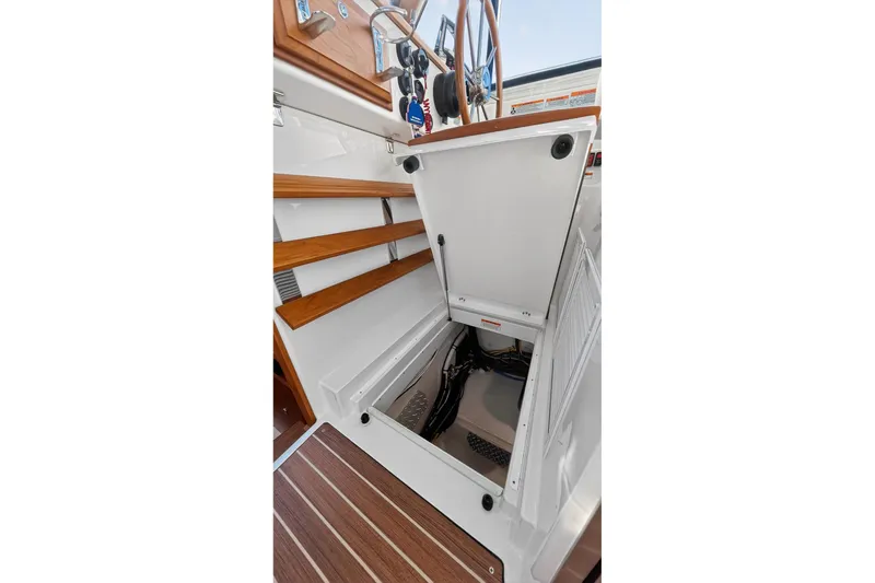 Slide: The Image of 2024 Back Cove 39O Yacht with storage compartment below the helm station - 56