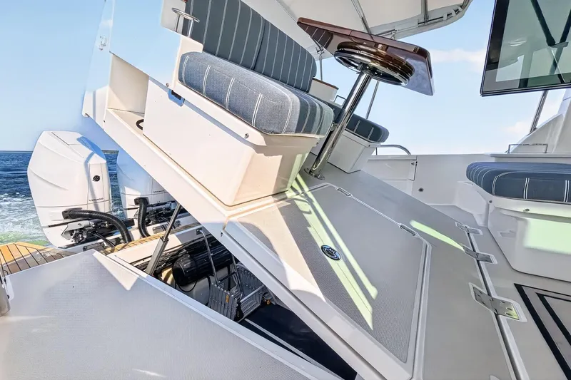 Slide: The Image of 2024 Back Cove 390 Yacht with huge storage area below cockpit sole - raises electrically - 62