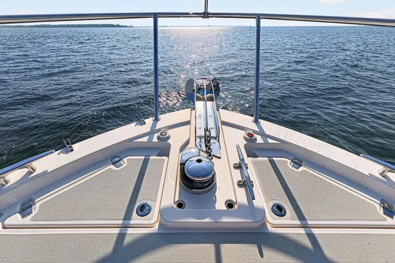 Slide: The Image of 2024 Back Cove 390 Yacht Foredeck with electric Windlass, forward storage compartments - 68
