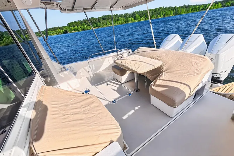 Slide: The Image of 2024 Back Cove 390 Yacht with custom Stamoid Cockpit Cover and Sunbrella covers for seats and table - 70